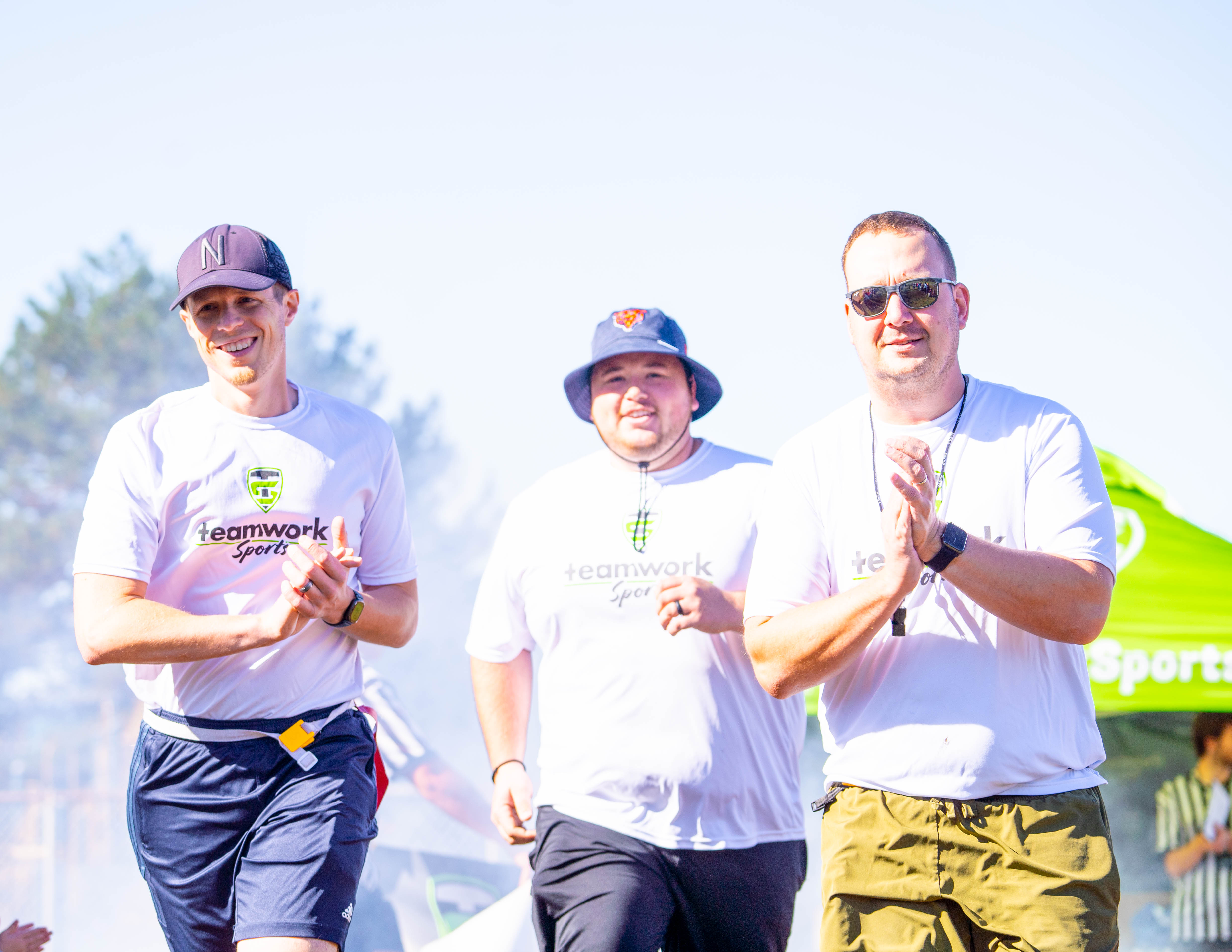 Teamwork Sports coaches cheering on the sideline